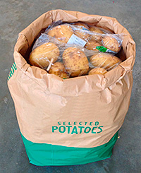 Corner-shop retailers use large sacks as a way to contain and display bulky items.