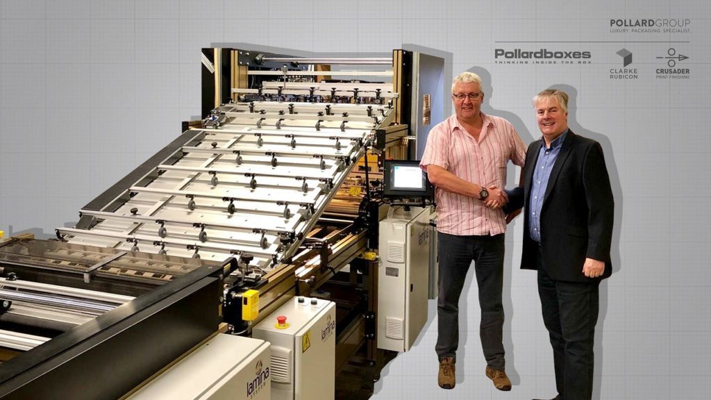 Two men standing in front of machinery