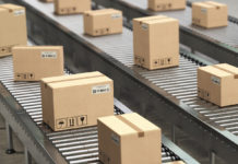 cardboard-boxes-on-conveyor-roller-in-distribution-6FZMTWA[90] (1)
