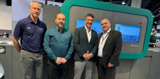 Mike Agness, Hybrid Software, Joe Sanchez and Ben Danon of Dantex Group, and Justin Bailey of Global Graphics Software celebrate their new partnership in front of the Pico digital UV inkjet press on the Dantex booth at Labelexpo Americas 2024.